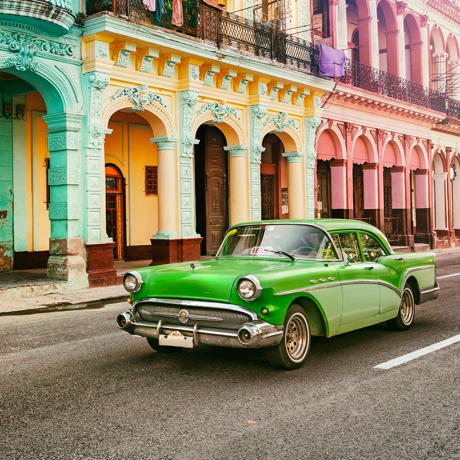 Green classic vintage American car in Havana, Cuba.